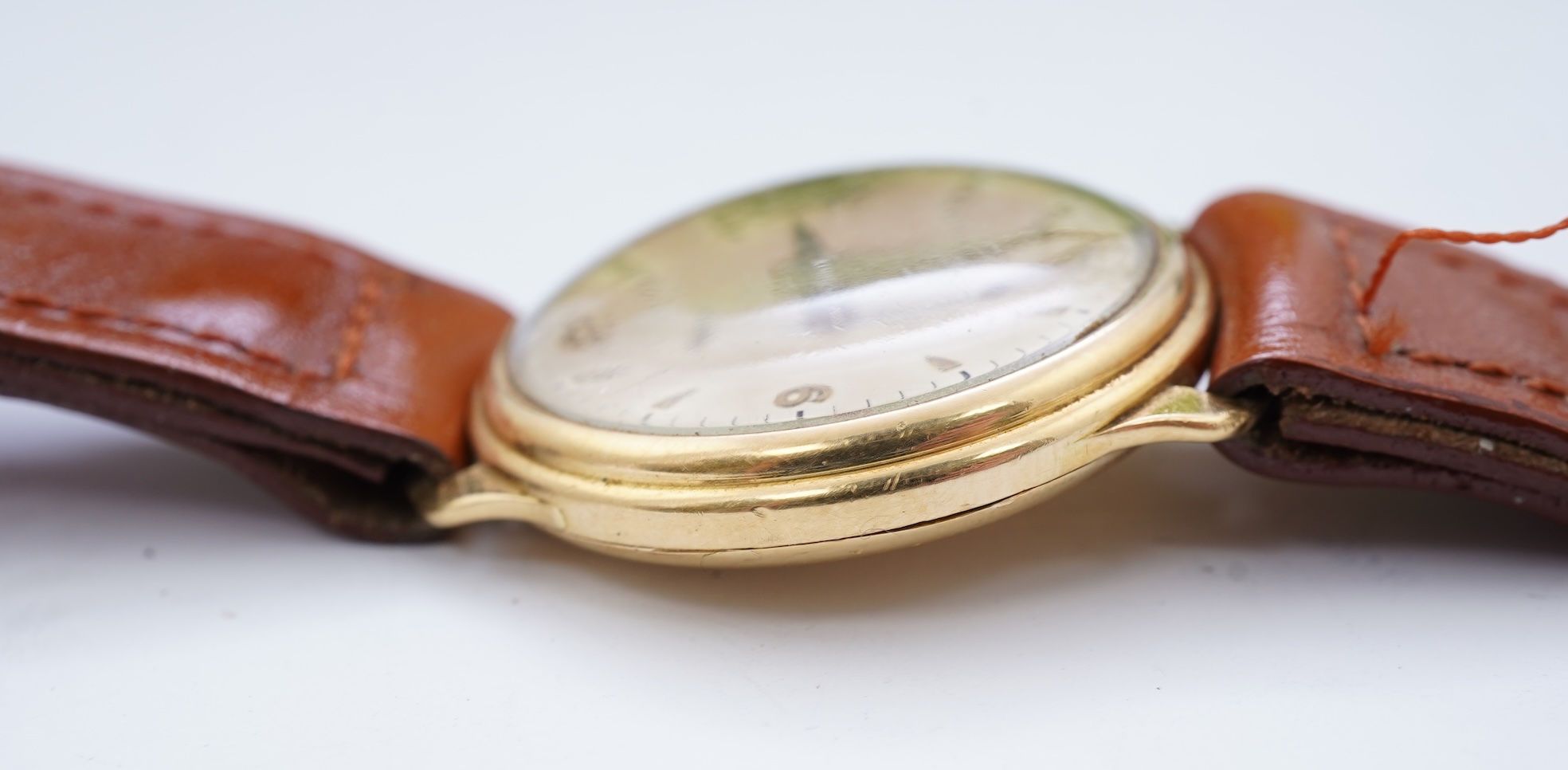 A gentleman's 1950's 18ct gold Zenith manual wind wrist watch